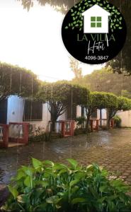 a picture of a house in the rain at Hotel La Villa in Retalhuleu