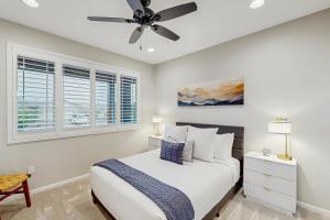 a bedroom with a bed and a ceiling fan at Blue Agave Dreams in Marana +14 photos