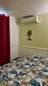 Ένα ή περισσότερα κρεβάτια σε δωμάτιο στο Balisier 107 Anse des Rochers