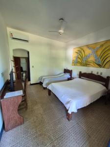 Postel nebo postele na pokoji v ubytování 4 Ventos Pousada + 3 fotografie