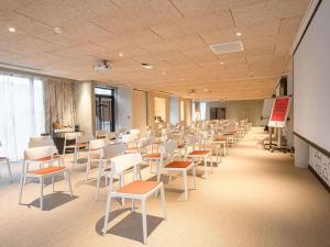a room with rows of chairs and a chalkboard at ibis Styles Montauban in Montauban +108 photos