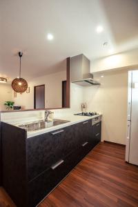 a kitchen with a sink and a refrigerator at Miyakojima - House - Vacation STAY 20446 in Hirara