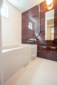 a bathroom with a shower and a mirror at Miyakojima - House - Vacation STAY 20446 in Hirara +9 photos