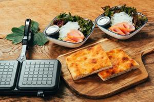 three bowls of food on a wooden table at Yura Green - Vacation STAY 73979v in Yura