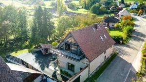 an overhead view of a house with a roof at Lorenz Home - Gîte d exception & balnéo in Neuve-Église