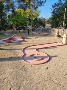 a park with a playground with a number on it at Mobile-Home 6 places Nans les pins in Nans-les-Pins
