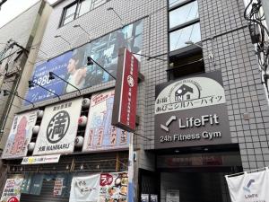 a building with signs on the side of it at Silver Heights 3rd floor 302,303,304 - Vacation STAY 59958v in Osaka