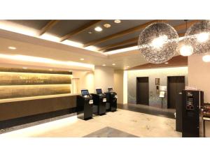 a hotel lobby with a row of pay phones at Smile Hotel Premium Kanazawa Higashiguchi Ekimae - Vacation STAY 65339v in Housai
