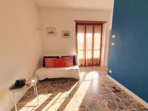a bedroom with a bed with red pillows on it at Fiori e Frutti Locazione Turistica in Almese +20 photos