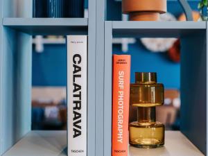 a shelf with a bottle of essential oils on it at Mercure Brest Centre Port in Brest +41 photos