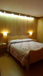 Postel nebo postele na pokoji v ubytování Albergo Ristorante K2