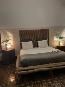 a bedroom with a large bed with two night stands at Cactus Host in Las Palmas de Gran Canaria +95 photos