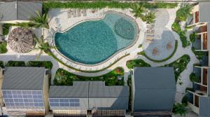 an overhead view of a swimming pool with solar panels at La Sen Village in Ninh Binh