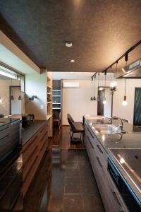 a large kitchen with a sink and a desk at Pino - Vacation STAY 20287 in Yamanakako