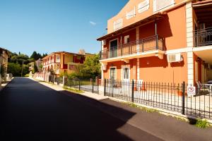 an empty street in a town with buildings at Solena Studios Kavos in Kavos