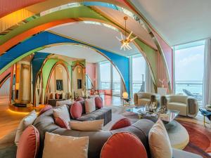 a large living room with a couch and chairs at Raffles Doha in Doha +228 photos