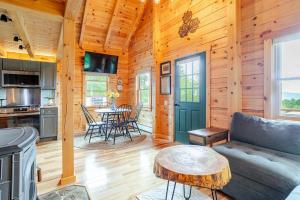 a living room with a couch and a table at The Greylock Cabin in Florida
