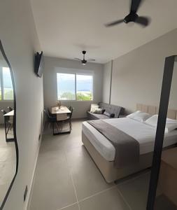 Giường trong phòng chung tại Kitnet com VISTA MAR em Santos