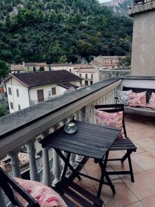 a table and chairs on a balcony with a view at Le Terrazze Sul Pollino B&B in Civita