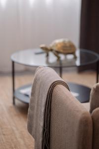 a living room with a coffee table and a couch at Suite Nr 4 - J26 LUXURY APARTMENT, Jauniela 26 Old Riga - TOP Location - 2BDR - 80m2 in Rīga