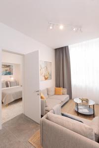 a living room with a couch and a table at Suite Nr 4 - J26 LUXURY APARTMENT, Jauniela 26 Old Riga - TOP Location - 2BDR - 80m2 in Rīga +81 photos