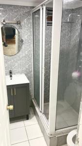 a bathroom with a shower and a sink and a mirror at Valparaiso's Best in Valparaíso +16 photos