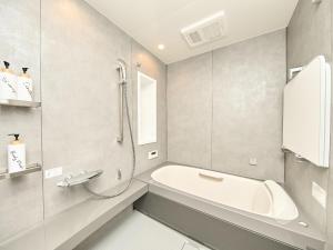 a bathroom with a bath tub and a shower at Ansolas-Villa - Vacation STAY 54282v in Tusi +39 photos