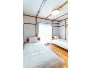 Postel nebo postele na pokoji v ubytování Mirai Stay Tsuboi - Vacation STAY 54038v + 66 fotografií