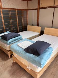 Giường trong phòng chung tại SUNNY HOUSE - Vacation STAY 54551v