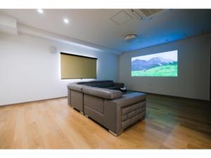 a living room with a couch and a flat screen tv at HOTEL ALL IN Kumamoto - Vacation STAY 55117v in Hanabatachō