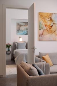 a living room with a couch and a bed at Suite Nr 4 - J26 LUXURY APARTMENT, Jauniela 26 Old Riga - TOP Location - 2BDR - 80m2 in Rīga