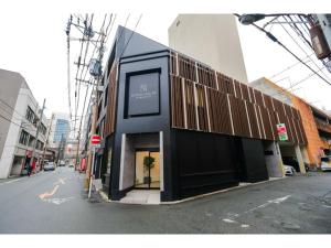 a black building on the side of a city street at HOTEL ALL IN Kumamoto - Vacation STAY 55144v in Hanabatachō +4 photos