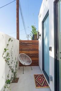 a patio with a chair and a fence at Brand New Studio in Mar Vista in Los Angeles