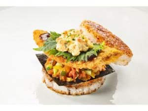 Un sándwich cortado por la mitad sobre un fondo blanco. en Hotel Reference Kokura Ekimae - Vacation STAY 56106v, en Kokura 7 fotos más