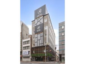 un revestimiento del exterior de un edificio en Hotel Reference Kokura Ekimae - Vacation STAY 56106v, en Kokura