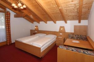 Säng eller sängar i ett rum på Hotel & Residence Egger