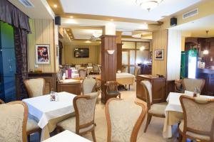 a dining room with tables and chairs at Hotel Bordo in Plovdiv