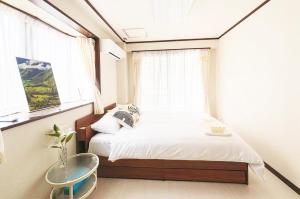 En eller flere senge i et værelse på Heim Mitomi - Vacation STAY 20357