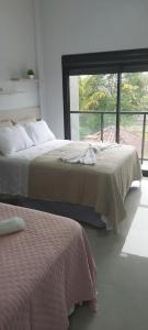 En eller flere senge i et værelse på Sobrado Praia, Beto Carrero Park + 53 billeder