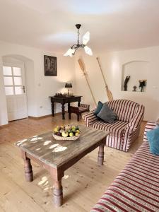 a living room with a coffee table and a couch at Humac Vero Apartments in Donji Humac