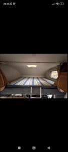 a television sitting on a shelf in a car at HOME & CAR 2x1 in Maspalomas