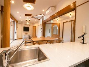 a kitchen and dining room with a sink and a table at VILLA ISE SHIMA - Vacation STAY 59170v in Ugata