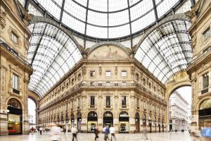 a large building with a glass domed ceiling at NH Linate in Peschiera Borromeo