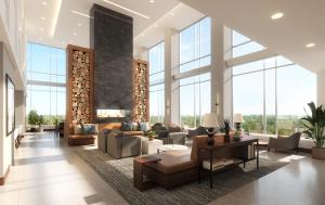 苏福尔斯Highpoint Hotel的大堂配有沙发、椅子和大窗户