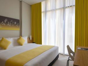 Postel nebo postele na pokoji v ubytování Adagio Doha + 103 fotografií