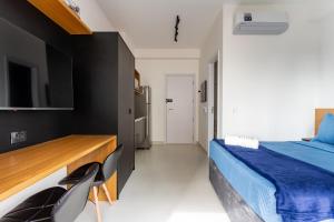 Postel nebo postele na pokoji v ubytování Essential Brooklyn - Stúdio com varanda e academia - By Easy Stay