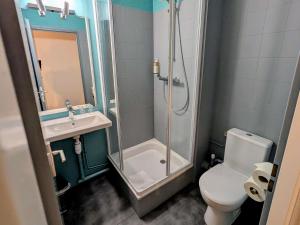 a bathroom with a shower and a toilet and a sink at greet Grenoble Centre Gare Accor Hotel in Grenoble +70 photos