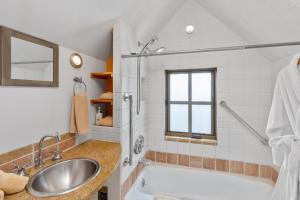 a bathroom with a tub and a sink at Galena Chalet - Valley View 1 Br 1 Ba 2 Half Ba Sleeps 4 in Telluride +16 photos