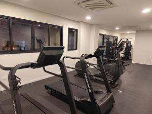 a gym with several tread machines in a room at Max Jardim São Paulo - Studios por temporada in Sao Paulo