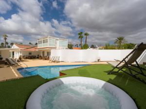 a backyard with a swimming pool and a house at Florida Home Private pool and Jacuzzi in San Bartolomé